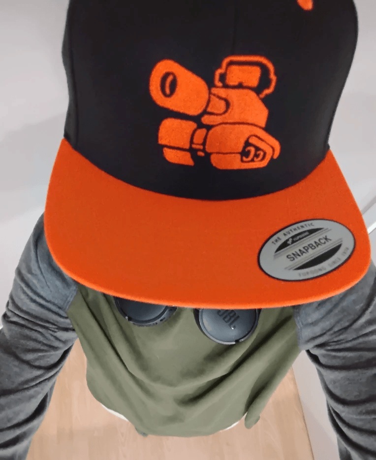 Proctored Games IRL wearing a Newgrounds hat